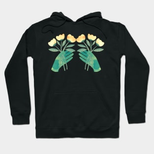 Green hands with yellow flowers for you on black background Hoodie